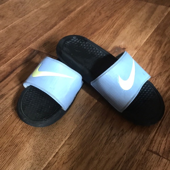 blue and yellow nike slides
